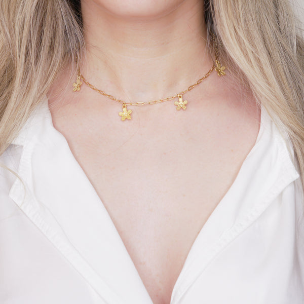 24k matte gold plated daisy chain paper clip chain necklace dangling charms lobster clasp on blonde girls neck