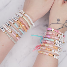 Load image into Gallery viewer, named word custom personalised elastic bracelets colourful multi colour charm bracelets bows tassels great affordable fine jewellery gifts for women birthday christmas heart bead pink green orange blue grey brown