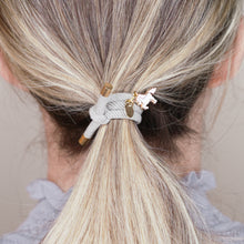 Load image into Gallery viewer, charm hair bands hair ties various colours enamel pink white unicorn with tag on jewellery grey on blonde long hair balayage highlights girl