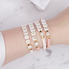 Load image into Gallery viewer, clay heishi bead gold plated personalised bracelets pink white gold letters pearls elastic bracelet salmon pink plastic on wrist

