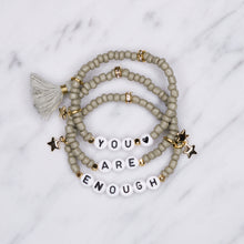 Load image into Gallery viewer, 24k gold plated khaki mud grey tassel star rondelle gold charm black heart letters 'you are enough' affirmation stack bracelets stretch elastic painted beads