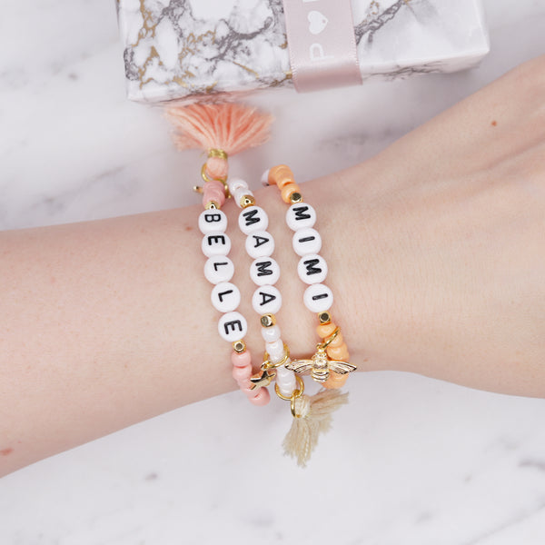24k gold plated painted bead elastic bracelets orange coral white shimmer pink enamel gold bee white cream tassel black heart accent feature bead plastic letter beads word personalised custom on wrist
