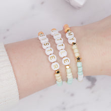 Load image into Gallery viewer, my little sister multicolour pastel stretch elastic bracelets orange pink champagne green mint white 24k gold plated star rondelle shimmer gold letter plastic beads on wrist