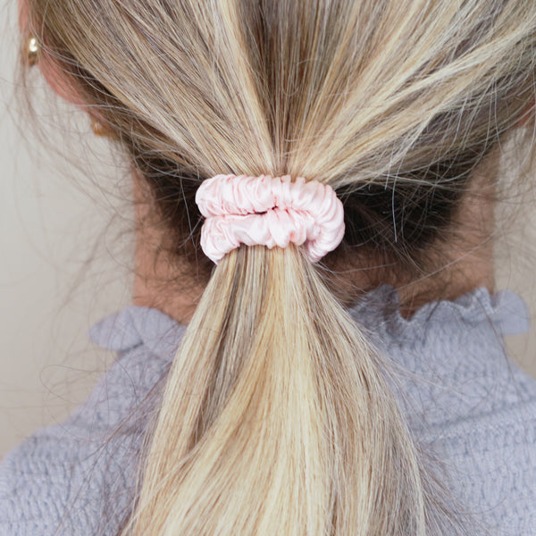 light baby pink mulberry silk soft hair tie hair band stretchy and kind to your hair on blond hair girl