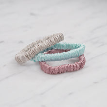 Load image into Gallery viewer, candy pink light baby blue grey warm silver trio three set mulberry silk soft hair tie hair band stretchy and kind to your hair on marble