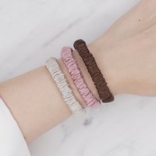 Load image into Gallery viewer, ice cream Neapolitan chocolate brown dusty pink grey warm silver trio three set mulberry silk soft hair tie hair band stretchy and kind to your hair on wrist