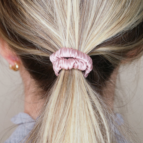 dusty rose pink mulberry silk soft hair tie hair band stretchy and kind to your hair on blonde girl balayage ombre hair