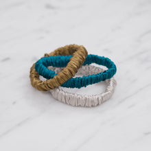 Load image into Gallery viewer, forest mud yellow mustard green turquoise grey warm silver trio three set mulberry silk soft hair tie hair band stretchy and kind to your hair on marble