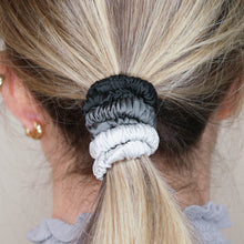 Load image into Gallery viewer, black dark grey monochrome ink grey cool silver trio three set mulberry silk soft hair tie hair band stretchy and kind to your hair on blonde girl balayage ombre hair
