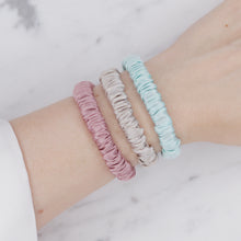 Load image into Gallery viewer, candy pink light baby blue grey warm silver trio three  set mulberry silk soft hair tie hair band stretchy and kind to your hair on wrist