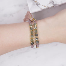 Load image into Gallery viewer, purple mink mauve painted beaded stretch elastic bracelets 24k gold plated tassel gold metallic letters custom word stars charm on wrist