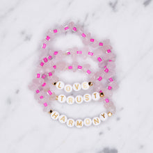 Load image into Gallery viewer, 24K gold plated rose quartz neon pink natural precious stone healing stone gold plated bracelet pearl shimmer gold letter beads word on marble
