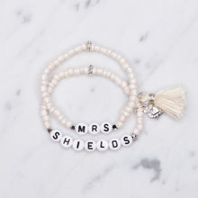 Load image into Gallery viewer, sparkling white shimmer painted bead pearlised bracelets mrs wife wedding style cream tassel and puffy heart charms sparkling rondelle silver beads acrylic black letter beads on marble