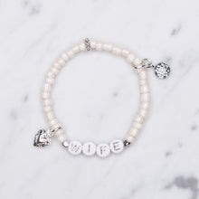 Load image into Gallery viewer, wife wedding bracelet white shimmer platinum plated charms silver plated beads rondelle sparkly painted beaded stretch elastic bracelet on marble