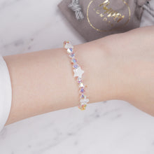Load image into Gallery viewer, Swarovski Crystal AB XILION Crystal bicone And Mother Of Pearl Stars Bracelet silver on wrist
