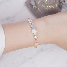 Load image into Gallery viewer, Swarovski Crystal AB XILION Crystal bicone And Mother Of Pearl Stars Bracelet silver on wrist