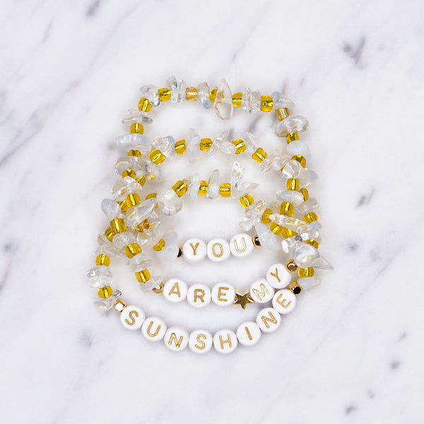 white opal and clear crystal quartz yellow natural precious stone healing bracelet 24k gold plated on marble 'you are my sunshine' custom personalised word phrase fine affordable jewellery