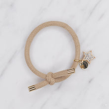 Load image into Gallery viewer, charm hair bands hair ties various colours gold star crystals with tag on jewellery tan beige on marble