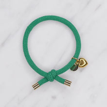 Load image into Gallery viewer, charm hair bands hair ties various colours gold heart with tag on jewellery green on marble