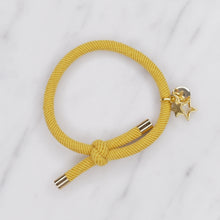 Load image into Gallery viewer, charm hair bands hair ties various colours gold star outline solid with tag on jewellery yellow mustard on marble