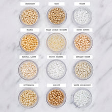 Load image into Gallery viewer, gold white beige yellow shimmer pearlised painted bead stretch elastic colour choice champagne sand white eggnog sugar cookie shimmer honey butter natural linen white shimmer antique white buttermilk biscuit white iridescent labelled on marble