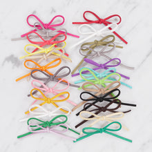 Load image into Gallery viewer, pink red orange green black beige white purple grey yellow lilac suedette bows on marble