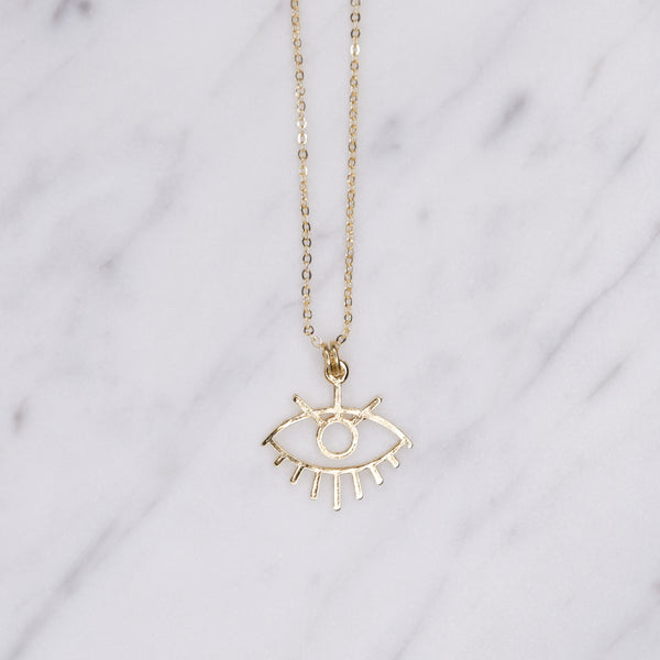 24k gold plated evil eye statement chain charm pendant necklace on marble