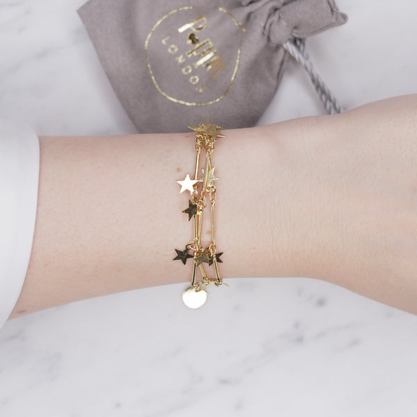 24k gold plated starburst star chain bracelet 3 layers lobster clasp on wrist