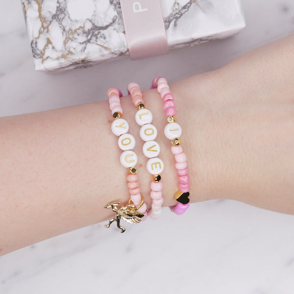 24k gold plated painted bead elastic stretchy bracelets multicolour pink shades 'i love you' cupid charm heart plastic gold heart rondelle 3 bracelets on wrist