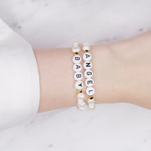Load image into Gallery viewer, freshwater pearl and glass bead white stretch elastic bracelets 24k gold plated rondelle sparkle angel baby acrylic black letter beads on wrist
