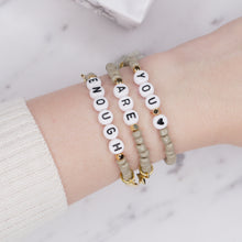 Load image into Gallery viewer, 24k gold plated khaki mud grey tassel star rondelle gold charm black heart letters &#39;you are enough&#39; affirmation stack bracelets stretch elastic painted beads on wrist
