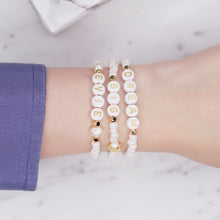 Load image into Gallery viewer, Cloud pink shimmer dream big evie personalised custom word phrase bracelets pearl 24K gold plated moon feature bead accent beads rondelle sparkling gold letter plastic beads on wrist blue shirt
