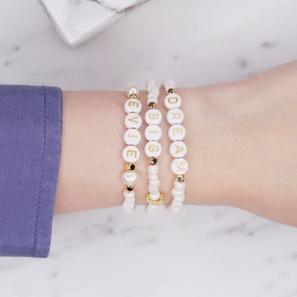 Cloud pink shimmer dream big evie personalised custom word phrase bracelets pearl 24K gold plated moon feature bead accent beads rondelle sparkling gold letter plastic beads on wrist blue shirt