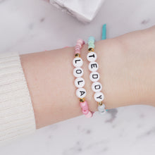 Load image into Gallery viewer, ombre pink blue painted beaded stretch elastic bracelets suede bows colourful gradient pattern gold plated star charms lola teddy girls boys childrens name custom personalised rondelle sparkly plastic beads on wrist
