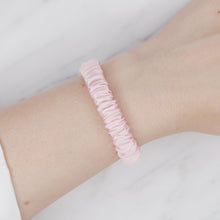 Load image into Gallery viewer, light baby pink mulberry silk soft hair tie hair band stretchy and kind to your hair on wrist
