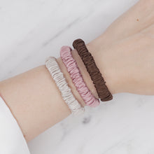 Load image into Gallery viewer, ice cream Neapolitan chocolate brown dusty pink grey warm silver trio three set mulberry silk soft hair tie hair band stretchy and kind to your hair on wrist
