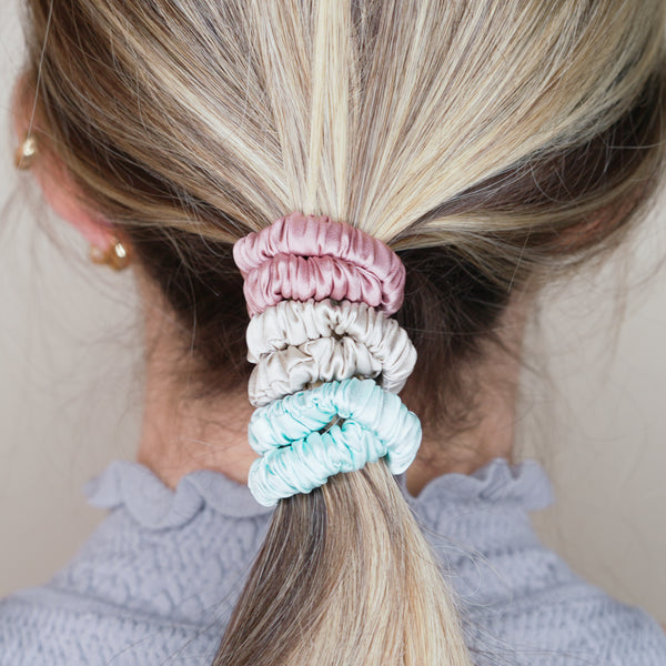 candy pink light baby blue grey warm silver trio three set mulberry silk soft hair tie hair band stretchy and kind to your hair on blond girl ombre balayage hair