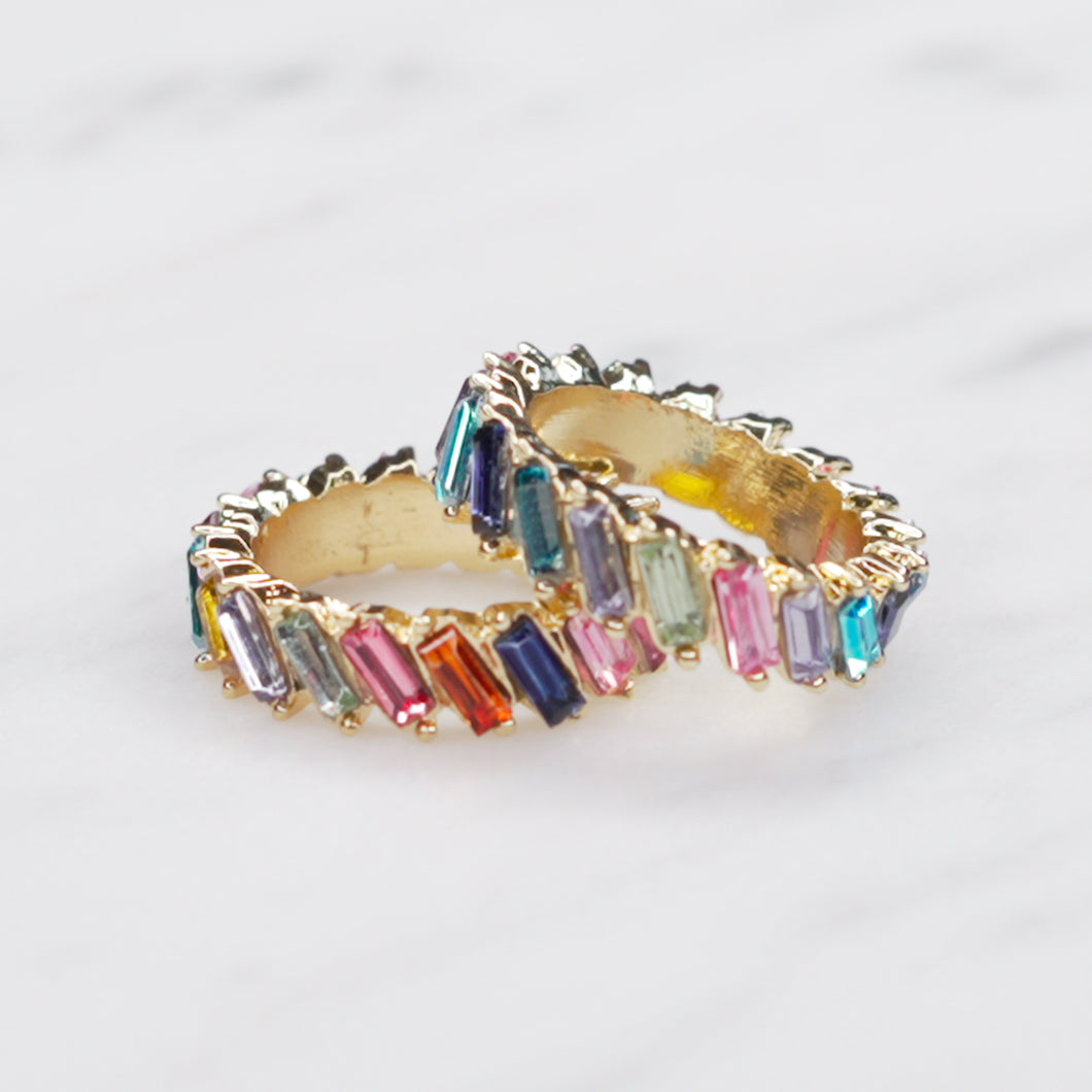 blue tones red tones multicolour rainbow colourful eternity ring baguette slanted rectangle cubic zirconia micro pave crystal shiny rings 2 on marble