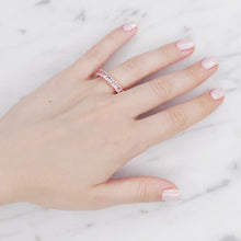 Load image into Gallery viewer, rose gold eternity ring baguette ring rectangle cubic zirconia micro pave crystal on finger 
