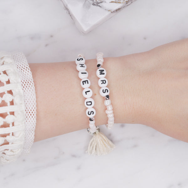 sparkling white shimmer painted bead pearlised bracelets mrs wife wedding style cream tassel and puffy heart charms sparkling rondelle silver beads acrylic black letter beads on wrist