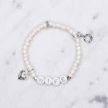 Load image into Gallery viewer, wife wedding bracelet white shimmer platinum plated charms silver plated beads rondelle sparkly painted beaded stretch elastic bracelet on marble
