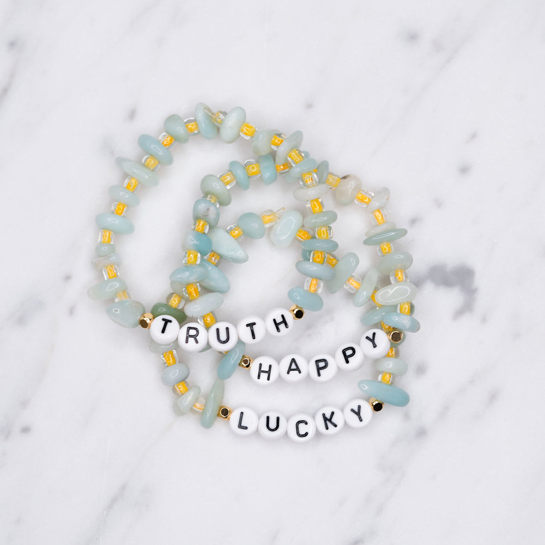 24K gold plated turquoise and yellow amazonite natural precious stone healing stone gold plated bracelet pearl shimmer black letter beads word on marble
