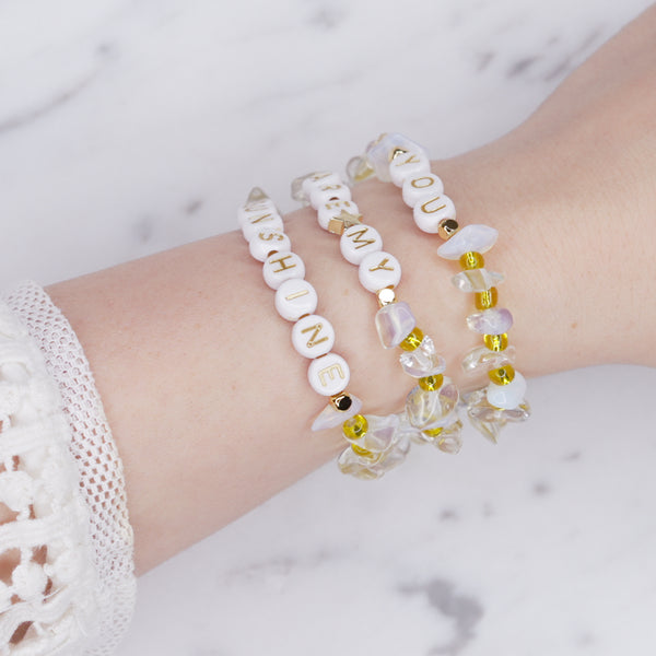 white opal and clear crystal quartz yellow natural precious stone healing bracelet 24k gold plated on marble 'you are my sunshine' custom personalised word phrase fine affordable jewellery on wrist