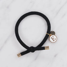 Load image into Gallery viewer, charm hair bands hair ties various colours enamel initial E letter with tag on jewellery black on marble
