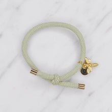 Load image into Gallery viewer, charm hair bands hair ties various colours gold bee with tag on jewellery light mint green on marble
