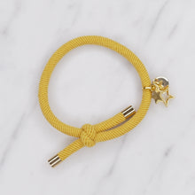 Load image into Gallery viewer, charm hair bands hair ties various colours gold star outline solid with tag on jewellery yellow mustard on marble
