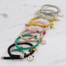 Load image into Gallery viewer, charm hair bands hair ties various colours unicorn star bee strawberry heart pink tan light green yellow mustard black grey on marble
