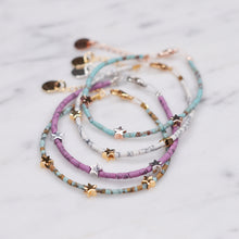 Load image into Gallery viewer, clay coloured beaded afghan bead bracelets purple aqua pink brown delicate 3 stars 24k gold plated silver plated rose gold plated wire bracelets on marble
