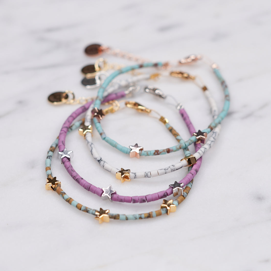 clay coloured beaded afghan bead bracelets purple aqua pink brown delicate 3 stars 24k gold plated silver plated rose gold plated wire bracelets on marble