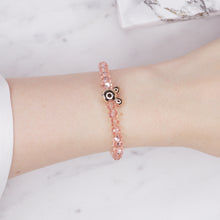 Load image into Gallery viewer, pink light ab shimmer rondelle crystal beads elastic stretch bracelet with mickey mouse plastic gold bead on wrist
